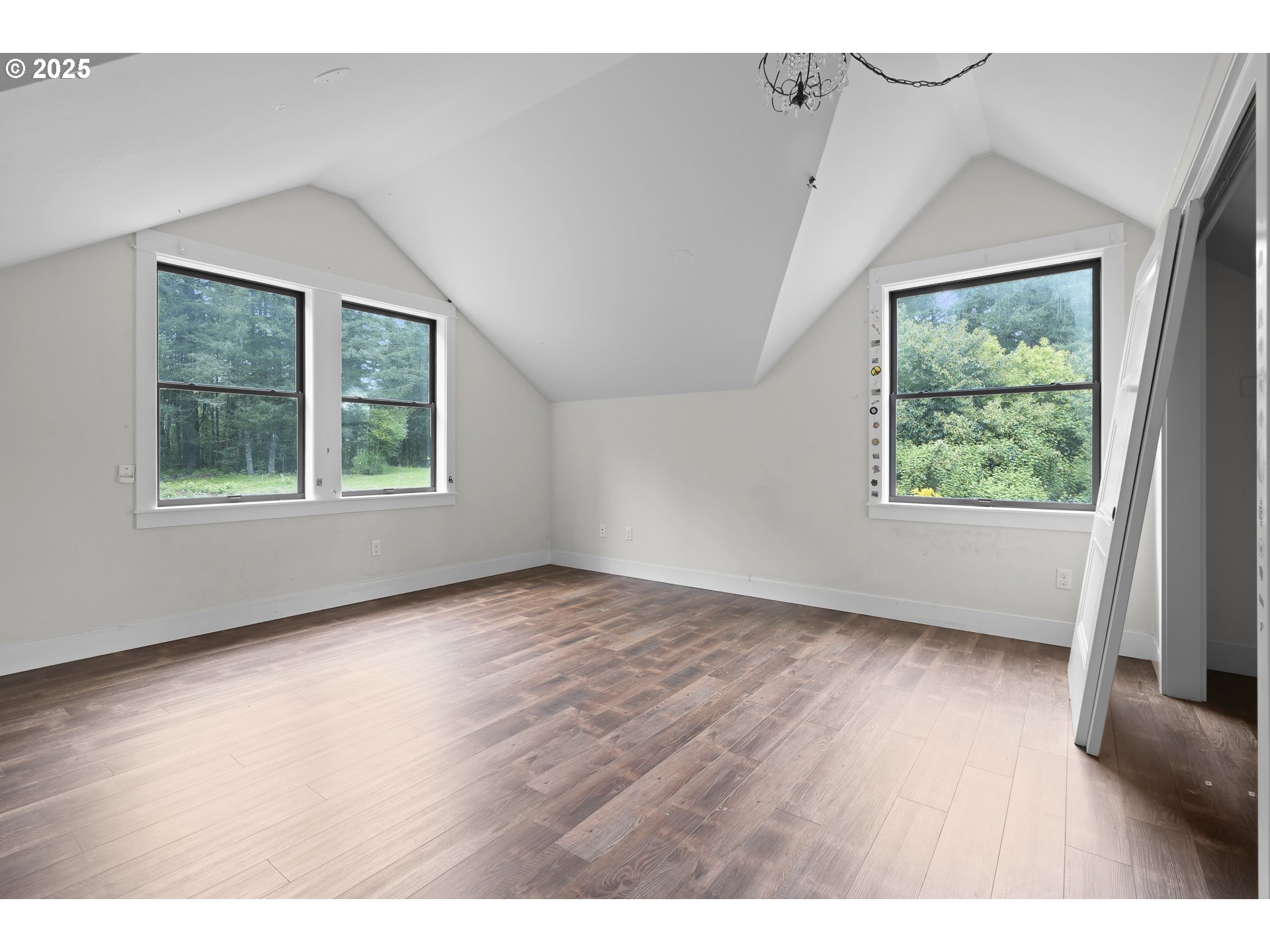 39665 Southeast Rude Road Sandy, OR 97055 - Photo 38 of 48 a view of an empty room with wooden floor and a window