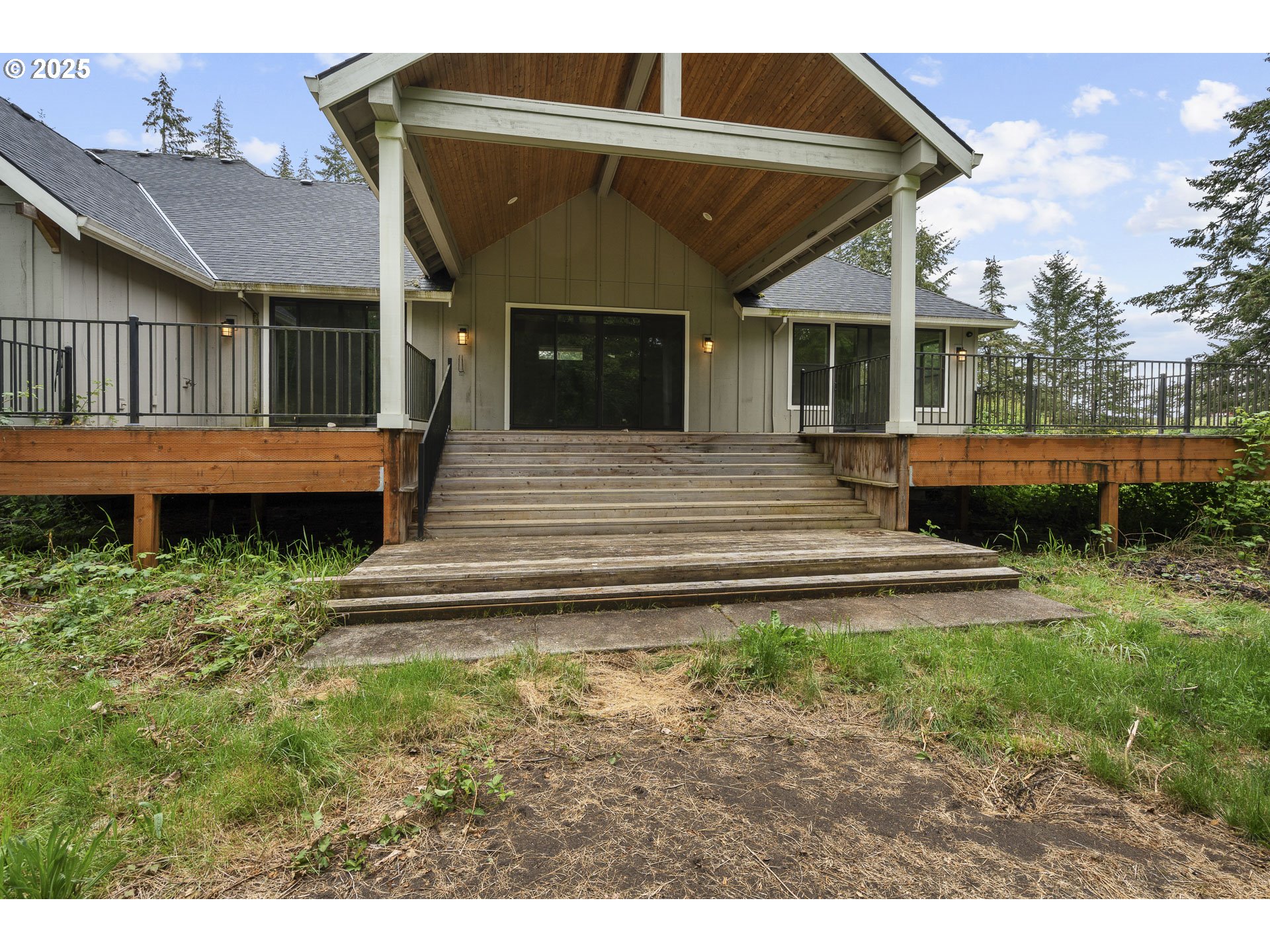39665 Southeast Rude Road Sandy, OR 97055 - Photo 41 of 48 a view of a house with a wooden deck and a yard