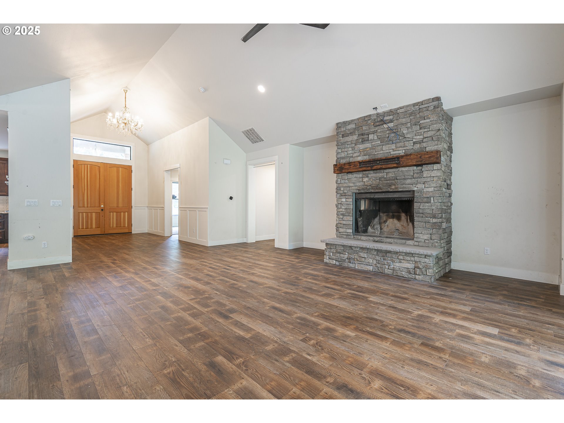 39665 Southeast Rude Road Sandy, OR 97055 - Photo 6 of 48 a view of empty room with wooden floor and fireplace