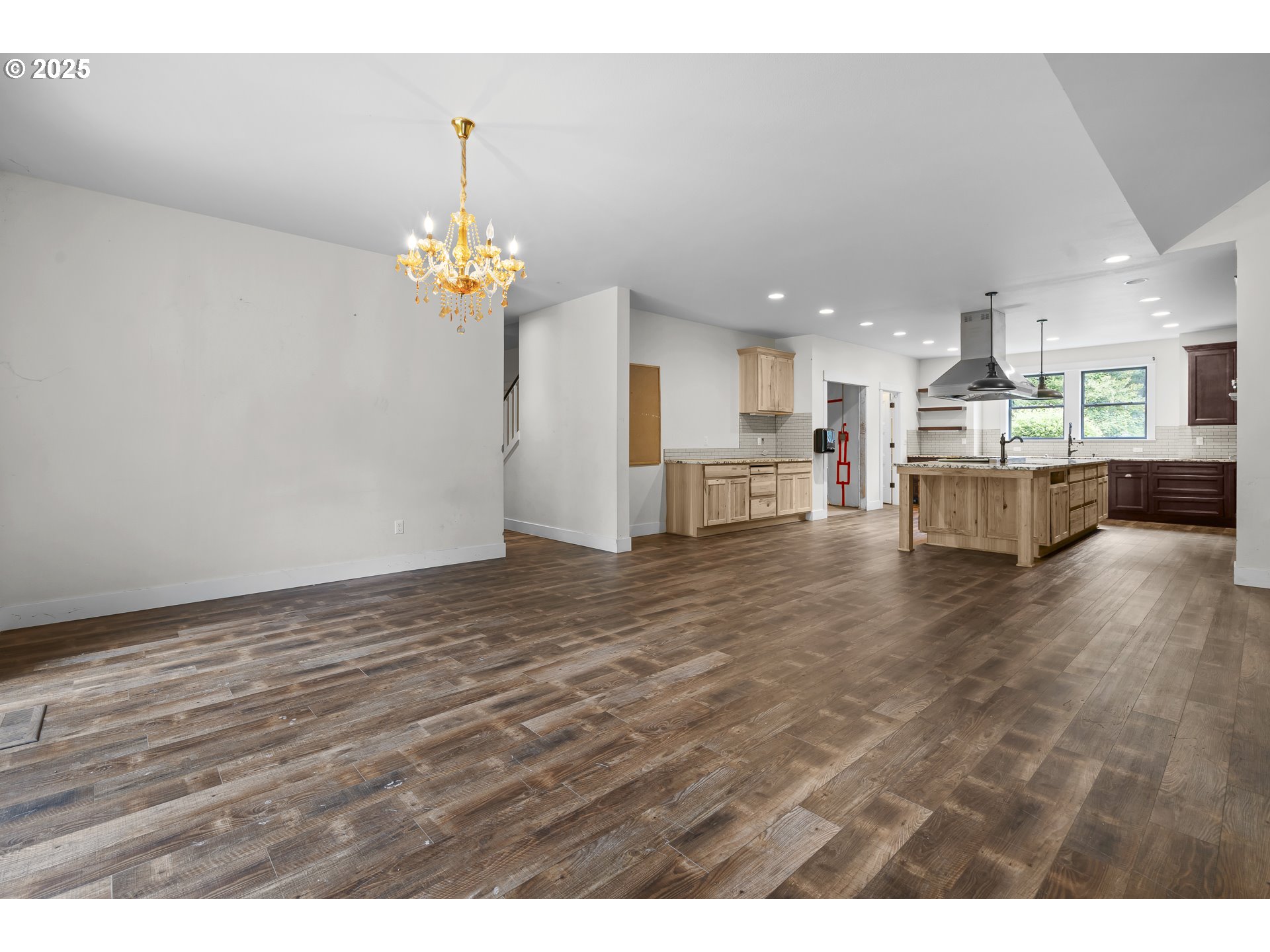 39665 Southeast Rude Road Sandy, OR 97055 - Photo 8 of 48 a view of a kitchen with kitchen island wooden floors stainless steel appliances