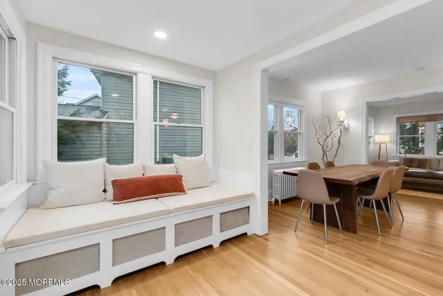 a spacious bathroom with a granite countertop sink and a mirror