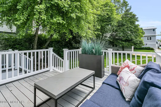 a view of a patio with a table and chairs