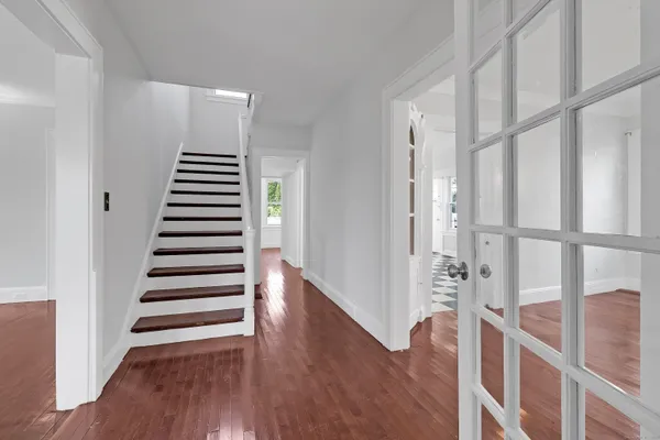 a view of entryway with wooden floor