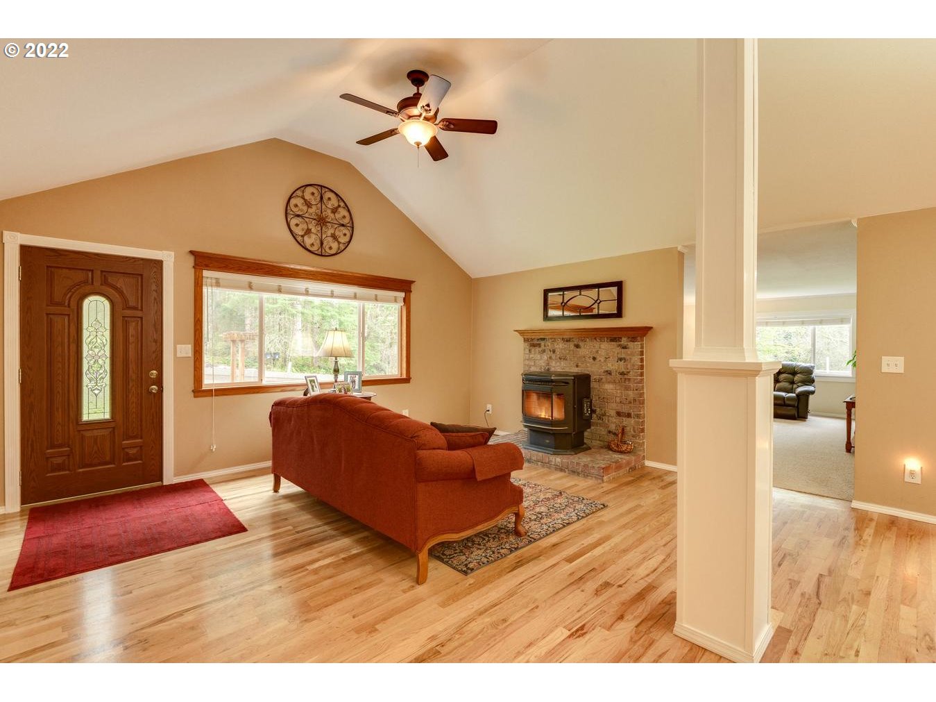 23767 Southeast McCabe Road Sandy, OR 97055 - Photo 12 of 32 a living room with furniture and a fireplace