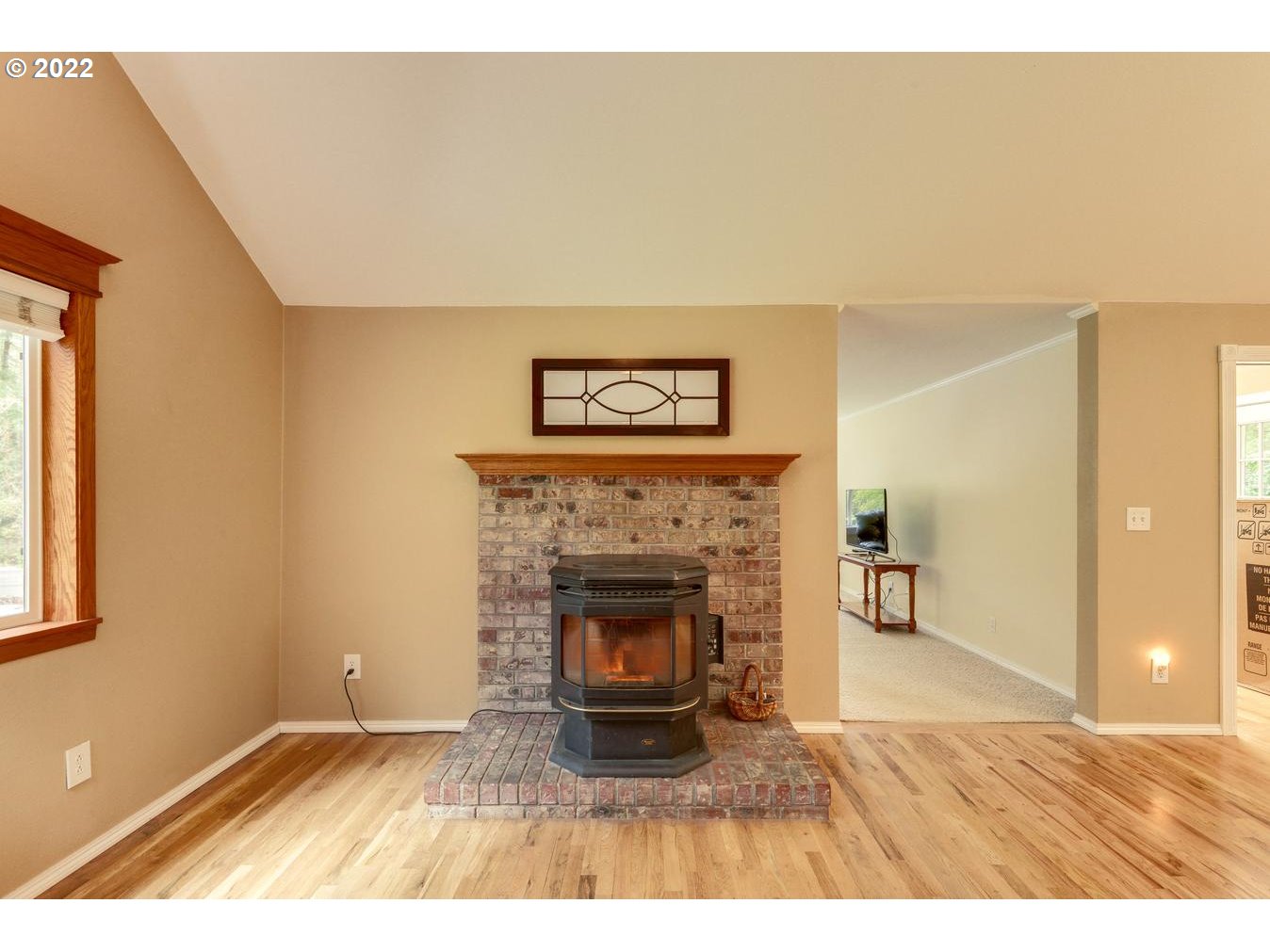 23767 Southeast McCabe Road Sandy, OR 97055 - Photo 14 of 32 a view of a livingroom with a fireplace and window
