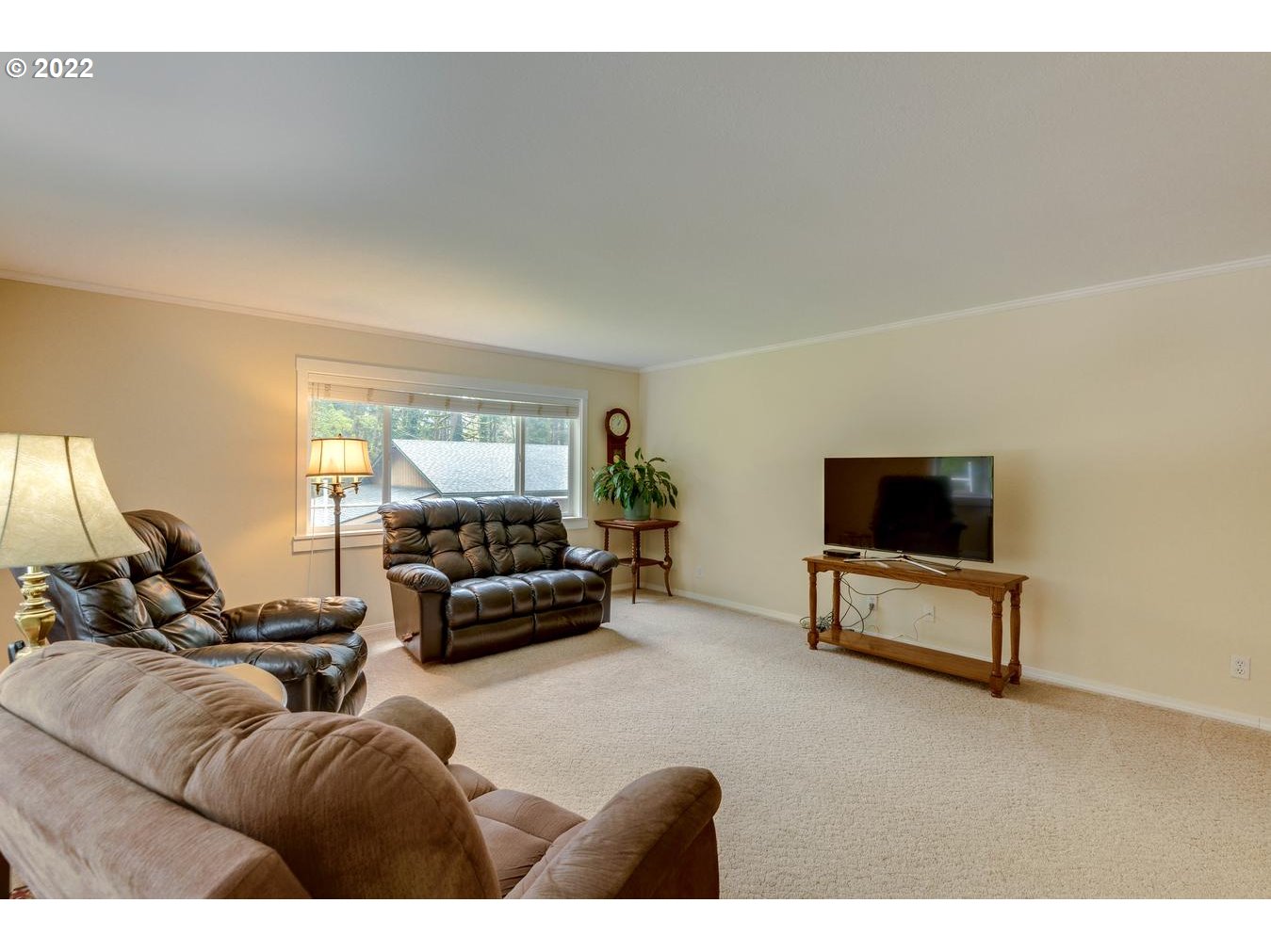 23767 Southeast McCabe Road Sandy, OR 97055 - Photo 16 of 32 a living room with furniture and a flat screen tv