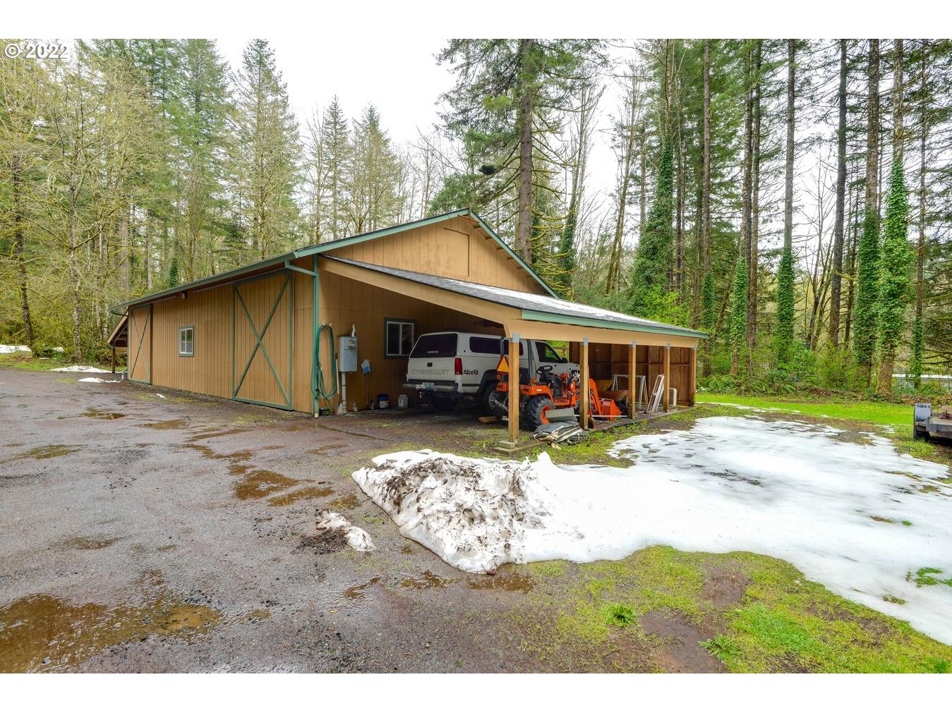 23767 Southeast McCabe Road Sandy, OR 97055 - Photo 29 of 32 a view of a yard in front of a house with large trees