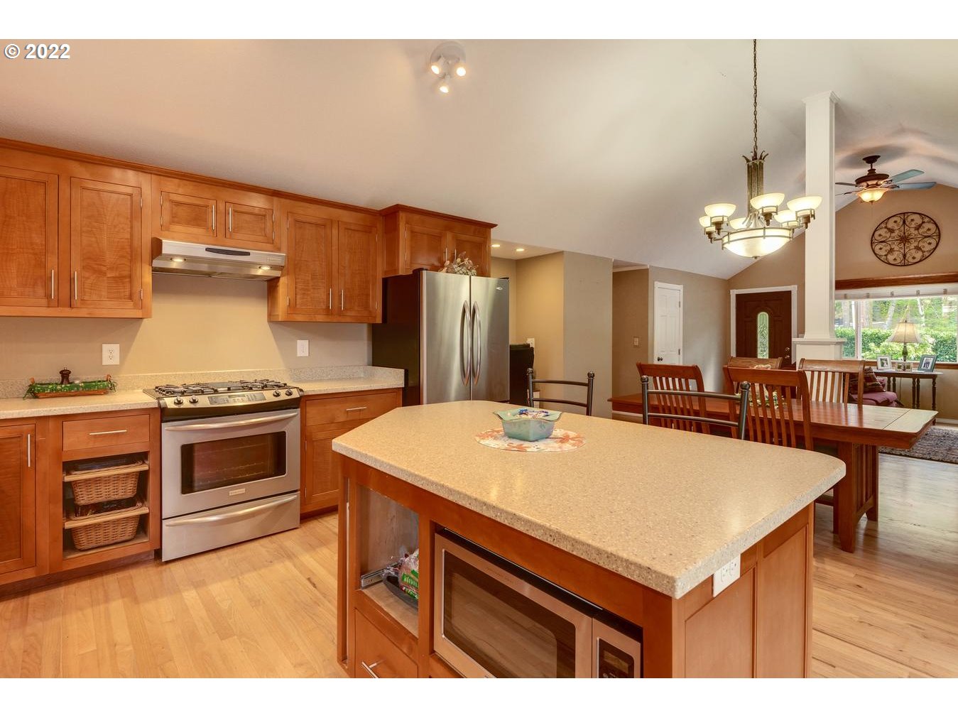 23767 Southeast McCabe Road Sandy, OR 97055 - Photo 10 of 32 a kitchen with a stove and a kitchen island