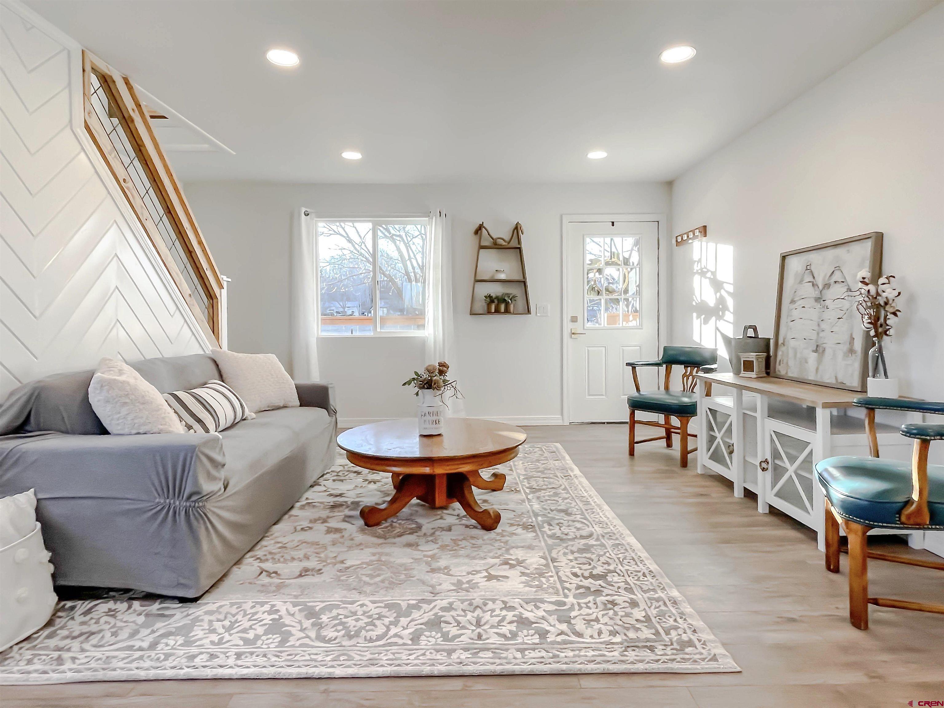 4956 1550 Road Delta, CO 81416 - Photo 11 of 35 a living room with furniture and a rug