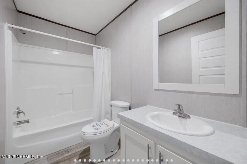 140 Islander Road Satsuma, FL 32189 - Photo 9 of 11 a bathroom with a sink toilet and shower