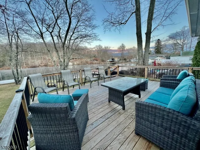 a balcony with furniture and a table