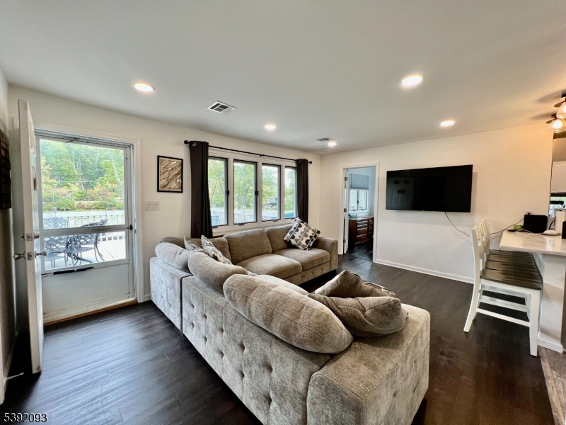 2 Hilltop Road Hopatcong, NJ 07821 - Photo 4 of 15 a living room with furniture and a flat screen tv