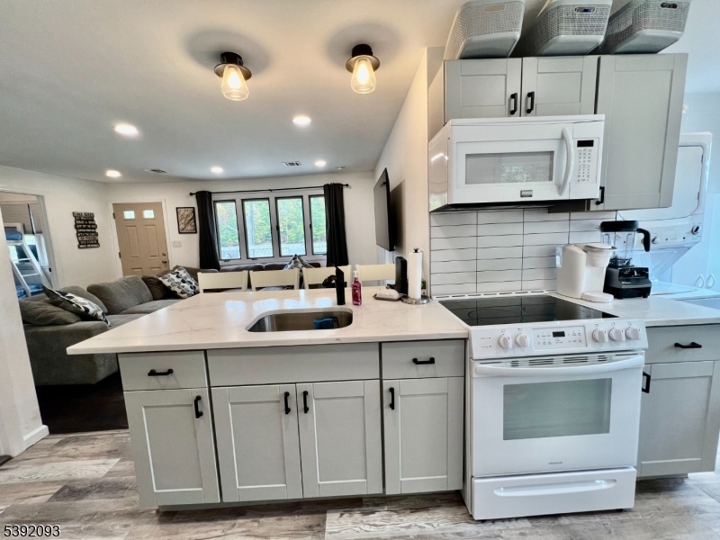 2 Hilltop Road Hopatcong, NJ 07821 - Photo 6 of 15 a kitchen with a sink stove and cabinets