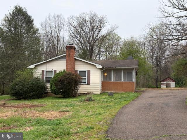 10080 Rixeyville Road Culpeper, VA 22701 - Photo 1 of 6 a front view of house with yard and green space
