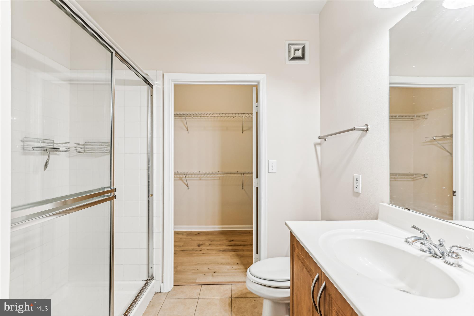 12941 Centre Park Circle, Unit 216 Herndon, VA 20171 - Photo 14 of 44 a bathroom with a sink toilet and shower