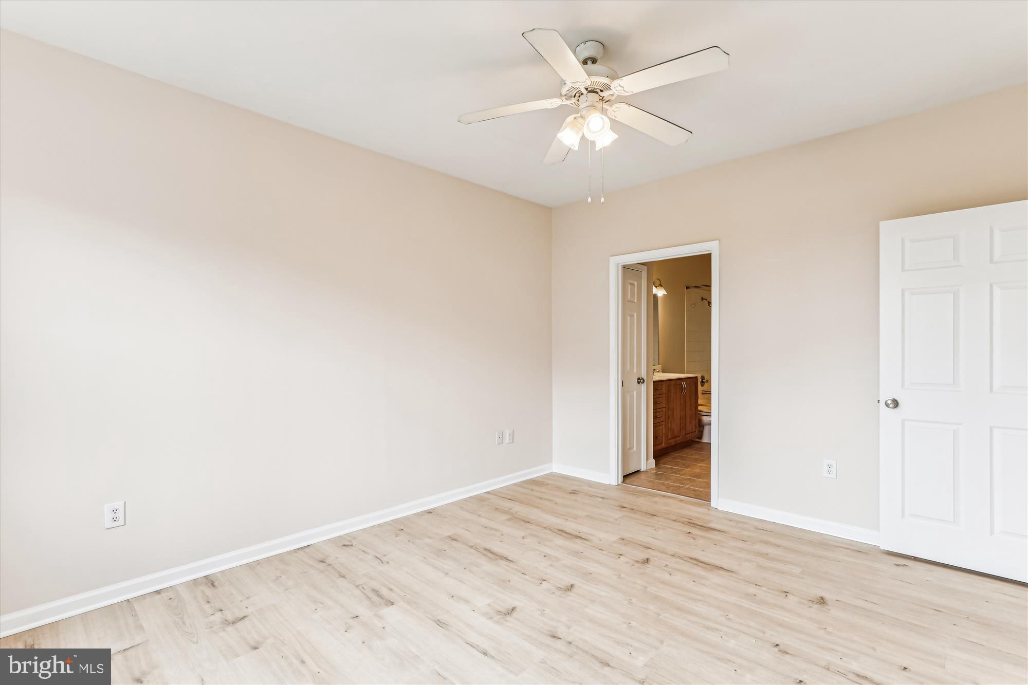 12941 Centre Park Circle, Unit 216 Herndon, VA 20171 - Photo 18 of 44 a view of an empty room with wooden floor