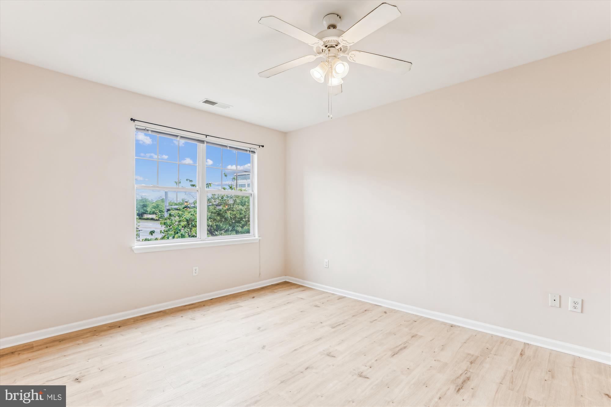 12941 Centre Park Circle, Unit 216 Herndon, VA 20171 - Photo 20 of 44 an empty room with a window and a fan