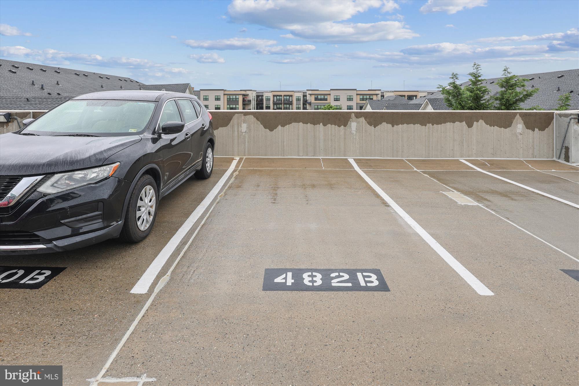 12941 Centre Park Circle, Unit 216 Herndon, VA 20171 - Photo 30 of 44 a view of a swimming pool with a car parked