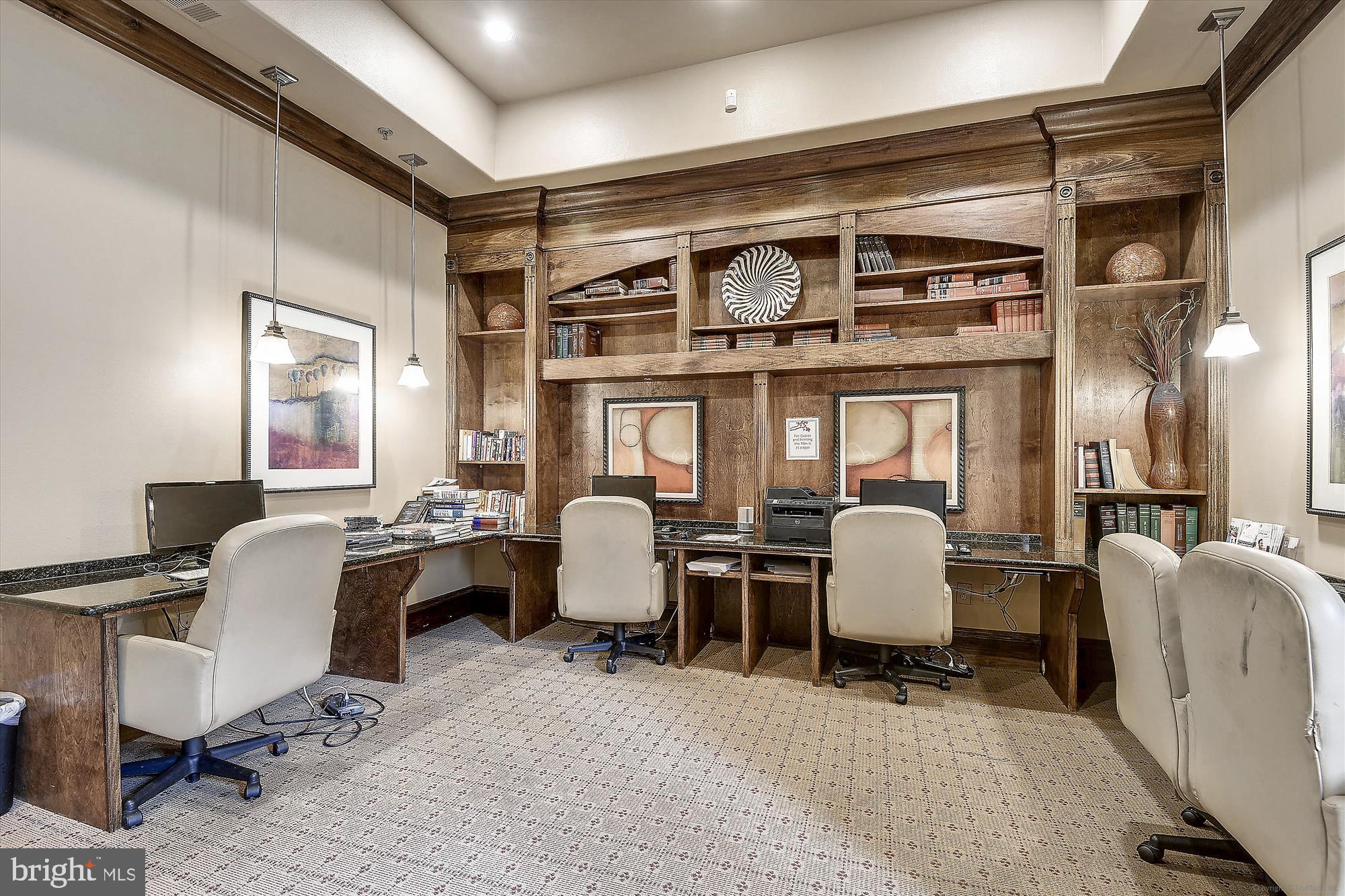 12941 Centre Park Circle, Unit 216 Herndon, VA 20171 - Photo 38 of 44 a view of a workspace with furniture and chandelier