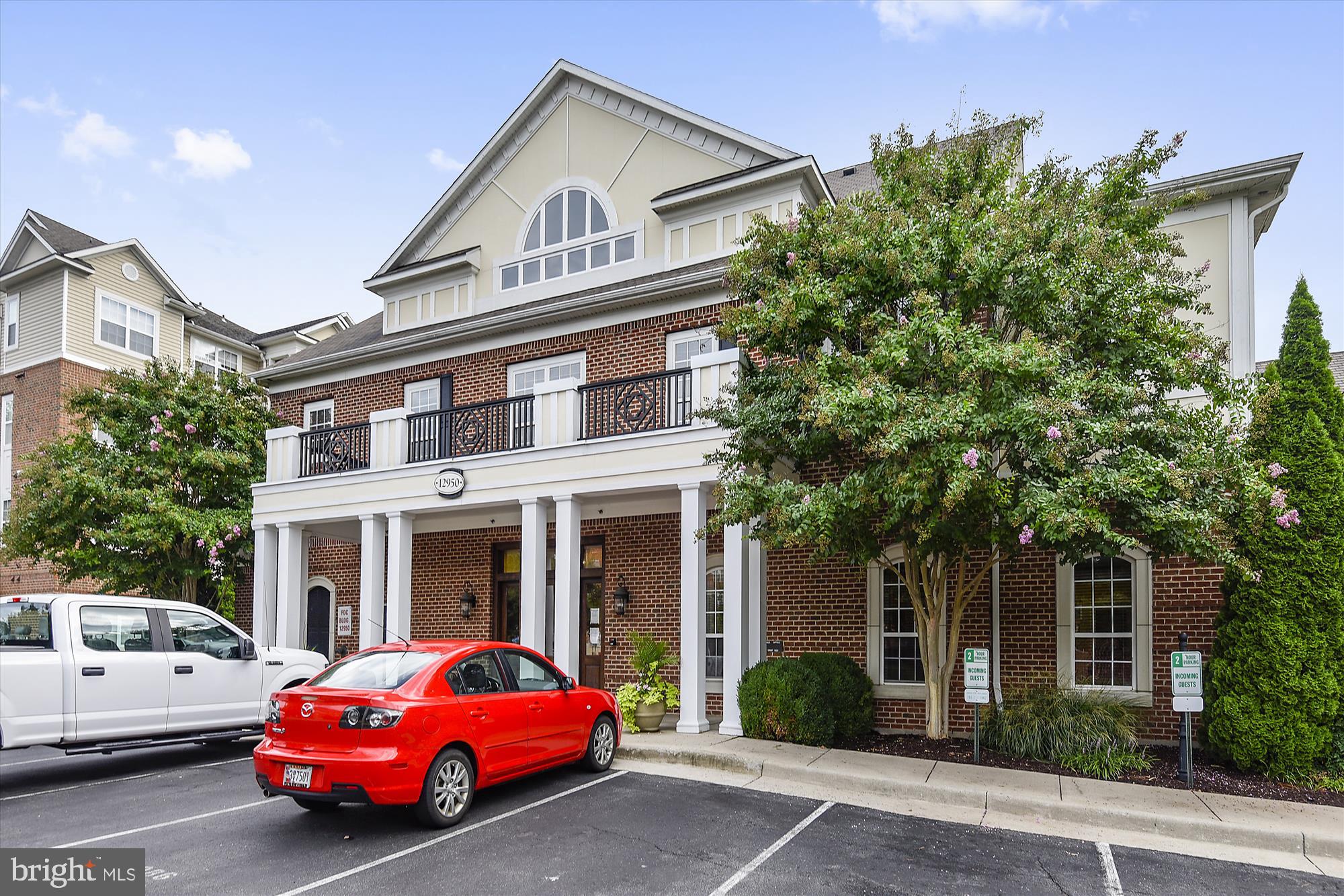 12941 Centre Park Circle, Unit 216 Herndon, VA 20171 - Photo 41 of 44 a car parked in front of a house
