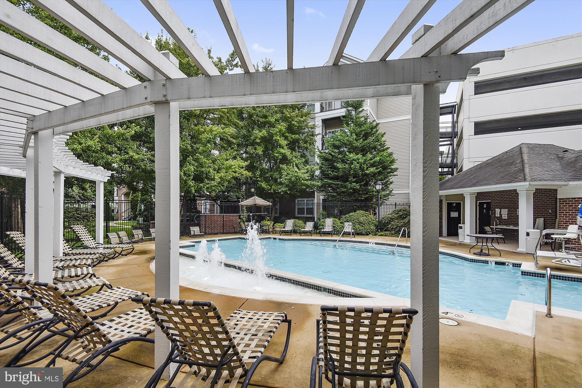 12941 Centre Park Circle, Unit 216 Herndon, VA 20171 - Photo 42 of 44 a outdoor space with swimming pool and furniture