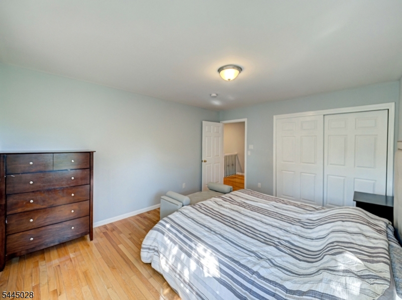 126 Blackwell Road Pennington, NJ 08534 - Photo 32 of 44 a bedroom with a bed and a mirror