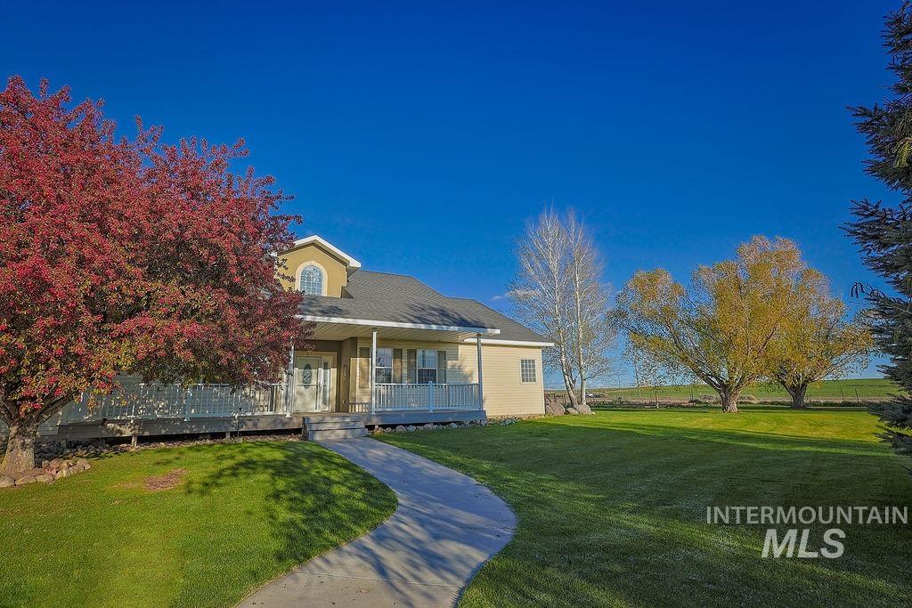 24 Harris Circle Shoshone, ID 83352 - Photo 1 of 39 View of front of property featuring a front lawn and covered porch