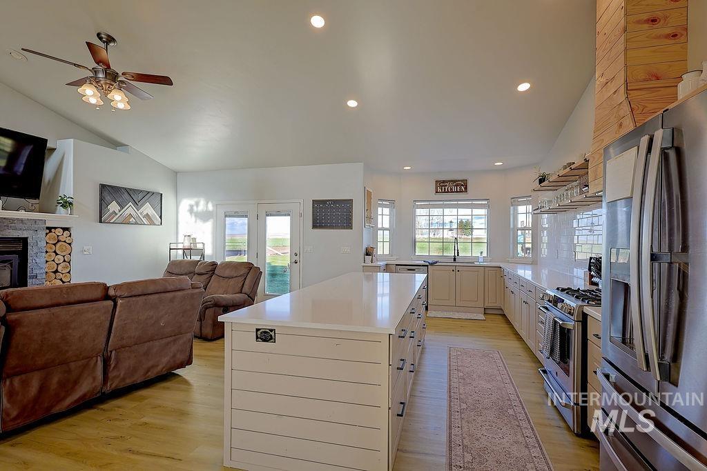 24 Harris Circle Shoshone, ID 83352 - Photo 39 of 39 Kitchen featuring stainless steel appliances, a kitchen island, open floor plan, healthy amount of natural light, and lofted ceiling
