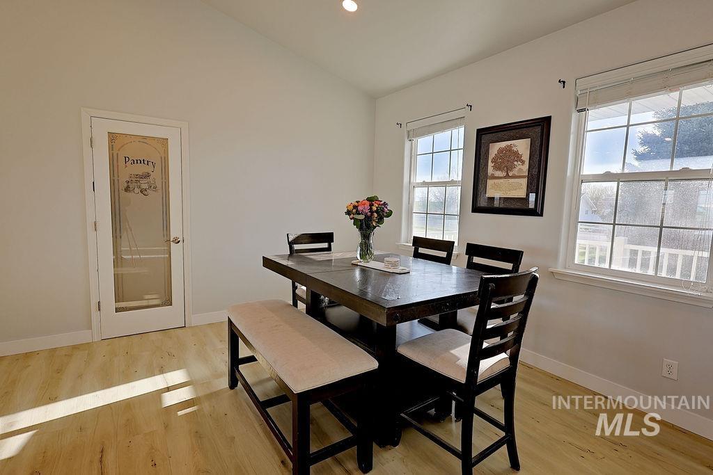 24 Harris Circle Shoshone, ID 83352 - Photo 13 of 39 Dining space with light wood-style floors, lofted ceiling, and recessed lighting