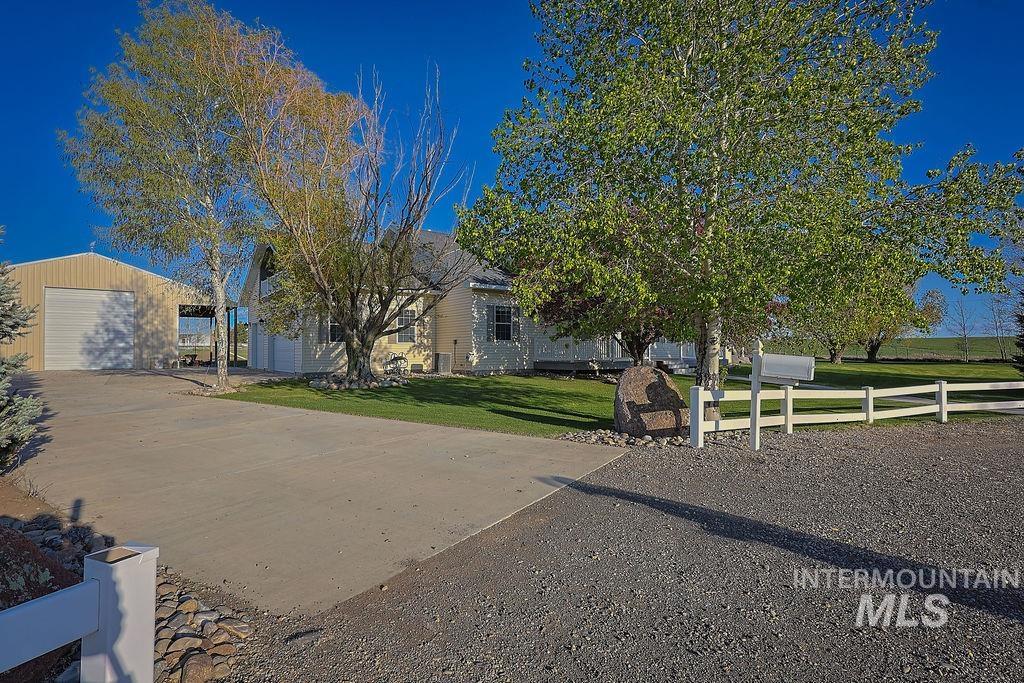 24 Harris Circle Shoshone, ID 83352 - Photo 2 of 39 Obstructed view of property featuring an outbuilding and driveway