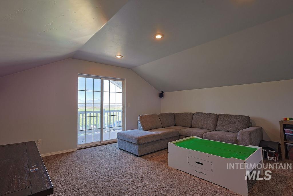 24 Harris Circle Shoshone, ID 83352 - Photo 22 of 39 Living area with carpet and recessed lighting