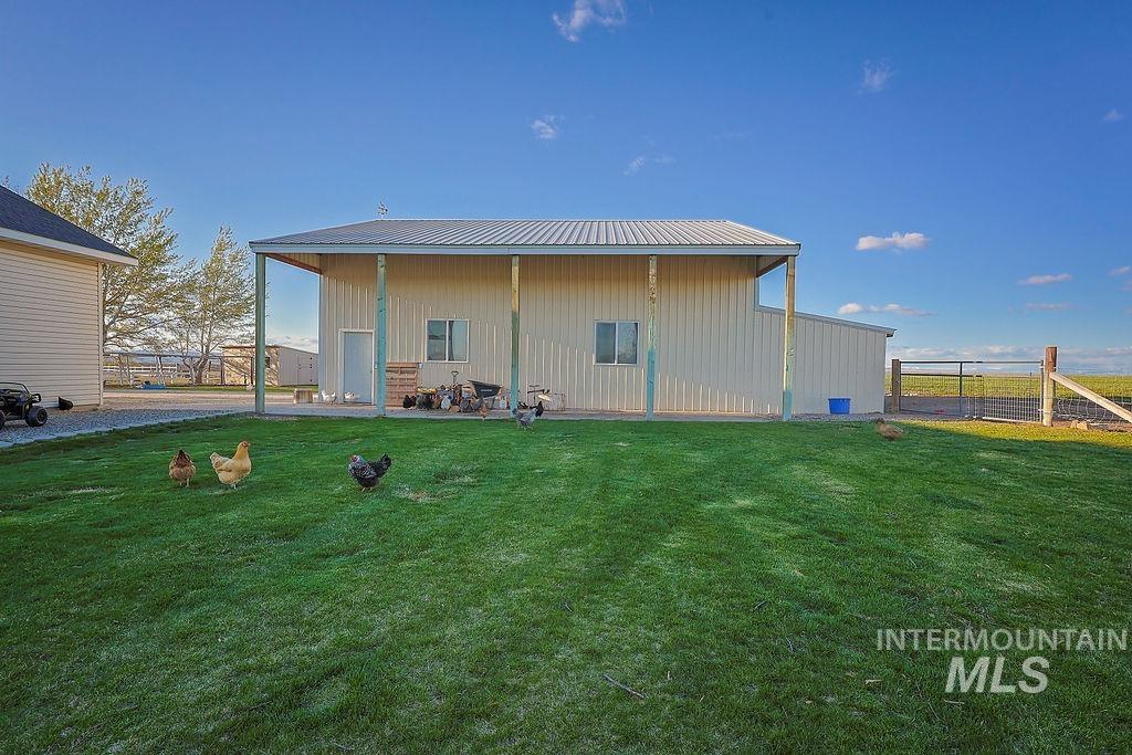 24 Harris Circle Shoshone, ID 83352 - Photo 31 of 39 Rear view of house featuring a metal roof and board and batten siding