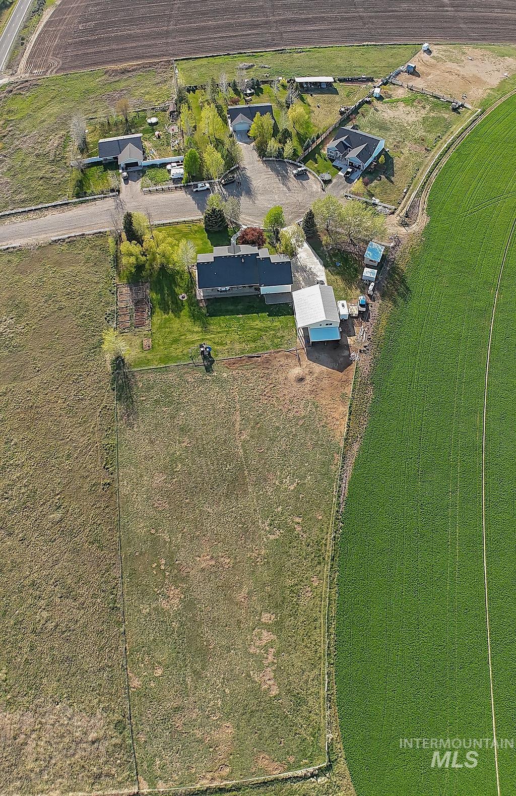 24 Harris Circle Shoshone, ID 83352 - Photo 34 of 39 Aerial perspective showcasing multiple structures and expansive surrounding fields