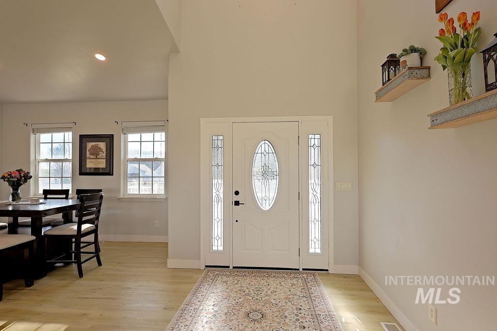 24 Harris Circle Shoshone, ID 83352 - Photo 5 of 39 Entrance foyer featuring light wood-style flooring, recessed lighting, and a high ceiling
