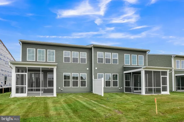 a big yard with large windows and a yard