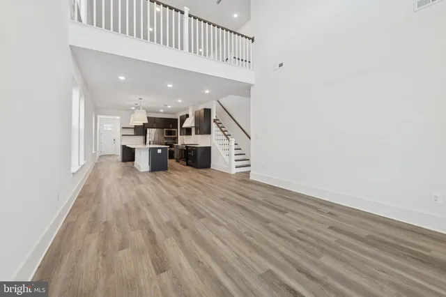 a view of kitchen with furniture and wooden floor