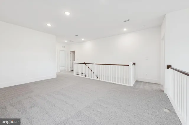 a view of an empty room with stairs