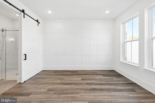 a bathroom with a double vanity sink mirror and shower