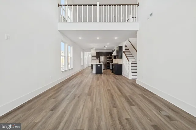 a view of kitchen with furniture and wooden floor