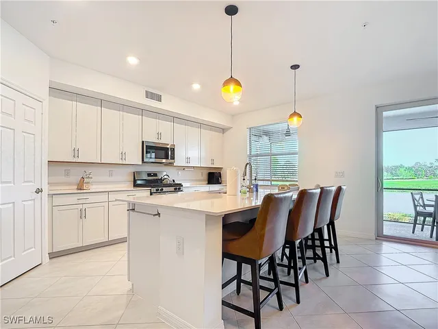 a kitchen that has a cabinets counter space and appliances