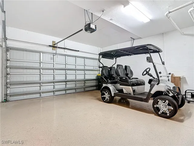 a view of a garage with parked cars