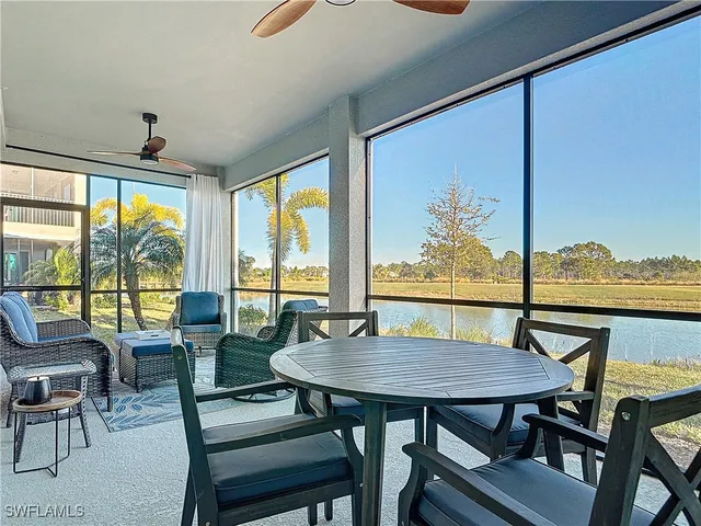 a view of a dining room with furniture and window