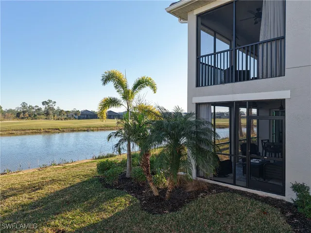 a view of a house with a yard from a balcony