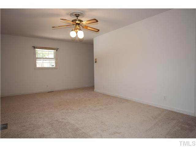 4317 Jimmy Rogers Road Durham, NC 27703 - Photo 16 of 25 Fourth of five bedrooms off main entrance. This bedroom is even larger than the master bedroom. Walk in closet. Bedroom