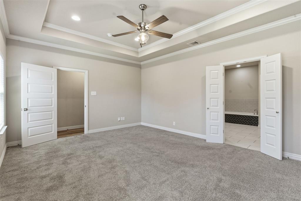 906 Chestnut Grove Drive Cleburne, TX 76033 - Photo 15 of 29 an empty room with closet and a ceiling fan