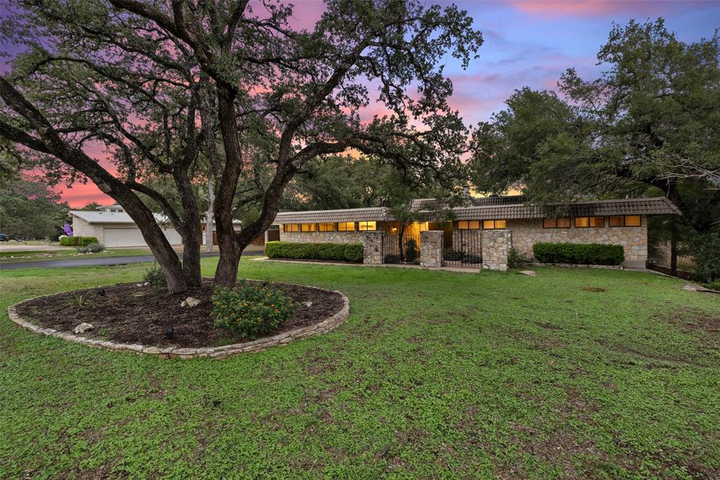 a view of a house with a back yard