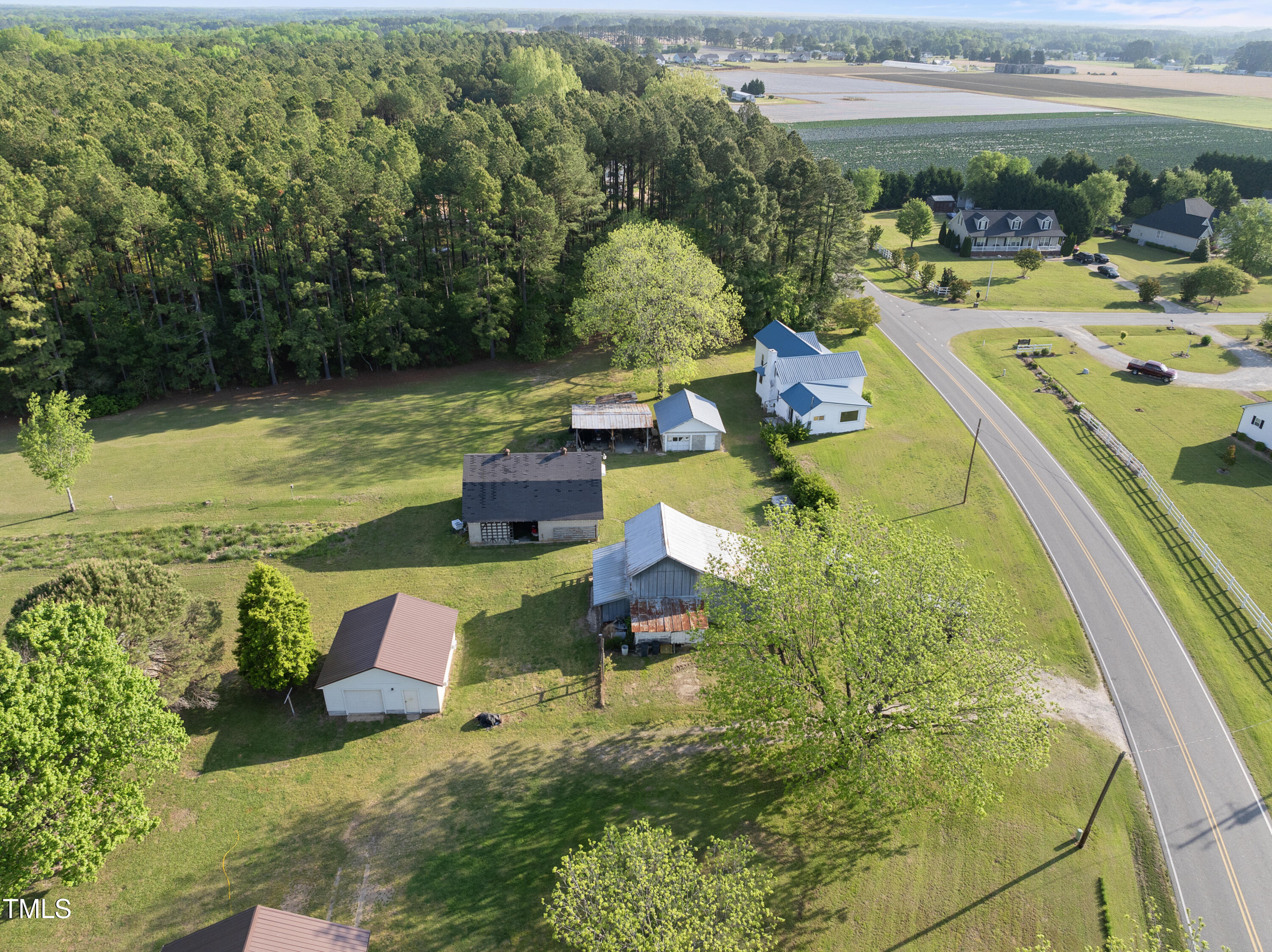 11766 Liles Road Bailey, NC 27807 - Photo 7 of 29 a swimming pool with outdoor seating and yard