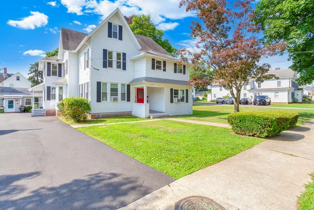 a front view of a house with a yard