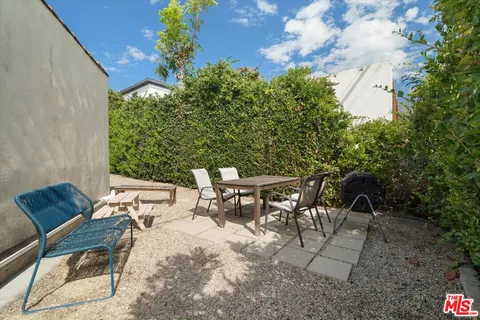 a car parked in front of a white house