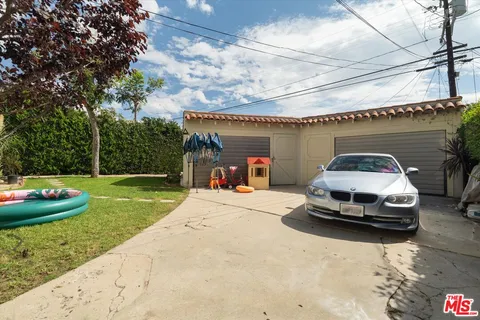 an aerial view of a house with yard